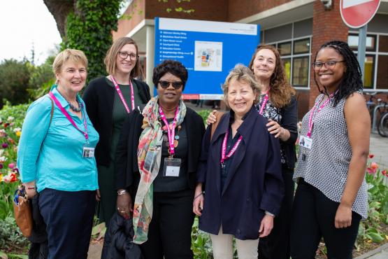 Group of women who work for Healthwatch, standing outside a hospital